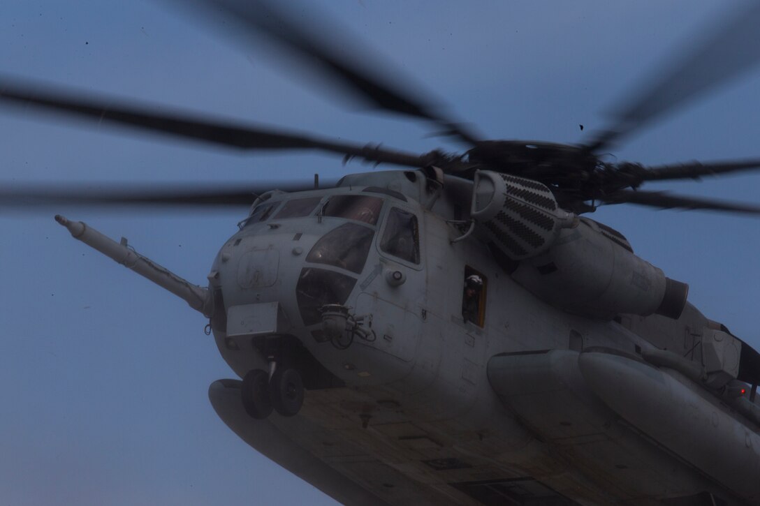 A U.S. Marine Corps CH-53E Super Stallion helicopter passes by during helocast training with Marines from the 1st Reconnaissance Battalion and Canadian soldiers with the Royal 22e Régiment as part of Rim of the Pacific (RIMPAC) exercise off the coast of Marine Corps Base Camp Pendleton, California, July 9, 2018. Helocasting is an airborne technique used by small unit, reconnaissance forces to insert into a military area of operations or maritime insertion point. RIMPAC demonstrates the value of amphibious forces and provides high-value training for task-organized, highly capable Marine Air-Ground Task Forces enhancing the critical crisis response capability of U.S. forces and partners globally. Twenty-five nations, 46 ships, five submarines, about 200 aircraft and 25,000 personnel are participating in RIMPAC from June 27 to Aug. 2 in and around the Hawaiian Islands and Southern California.