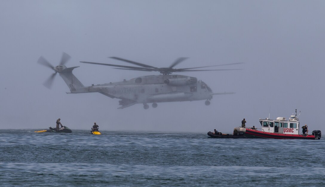 A U.S. Marine Corps CH-53E Super Stallion helicopter hovers over the ocean off the coast of Marine Corps Base Camp Pendleton, California, during helocast training with U.S. Marines with 1st Reconnaissance Battalion and Canadian soldiers with the Royal 22e Régiment as part of Rim of the Pacific (RIMPAC) exercise July 9, 2018. Helocasting is an airborne technique used by small unit, reconnaissance forces to insert into a military area of operations or maritime insertion point. RIMPAC demonstrates the value of amphibious forces and provides high-value training for task-organized, highly capable Marine Air-Ground Task Forces enhancing the critical crisis response capability of U.S. forces and partners globally. Twenty-five nations, 46 ships, five submarines, about 200 aircraft and 25,000 personnel are participating in RIMPAC from June 27 to Aug. 2 in and around the Hawaiian Islands and Southern California.