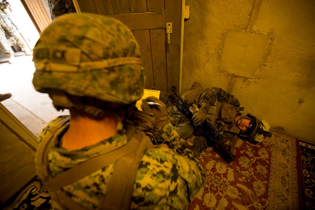 U.S. Marine Corps Lance Cpl. Austin Mellick, left, a fireteam leader with 2nd Battalion, 1st Marine Regiment, writes a nine-line report for a simulated casualty at an Infantry Immersion Trainer (IIT) during Rim of the Pacific (RIMPAC) exercise on Marine Corps Base Camp Pendleton, California, July 10, 2018. The IIT provided the Marines with “hands on” practical application of tactical skills and decision making in an immersive, scenario-based training environment. RIMPAC demonstrates the value of amphibious forces and provides high-value training for task-organized, highly capable Marine Air-Ground Task Forces enhancing the critical crisis response capability of U.S. forces and partners globally. Twenty-five nations, 46 ships, five submarines, about 200 aircraft and 25,000 personnel are participating in RIMPAC from June 27 to Aug. 2 in and around the Hawaiian Islands and Southern California.