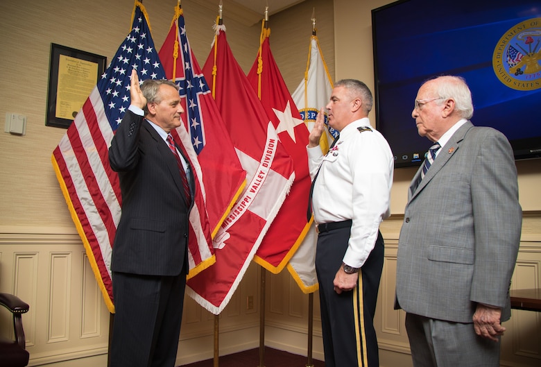 Mississippi River Commission President Maj. Gen. Richard Kaiser administers the oath of office to James A. Reeder at the MRC headquarters in Vicksburg, Miss., July 11, 2018.