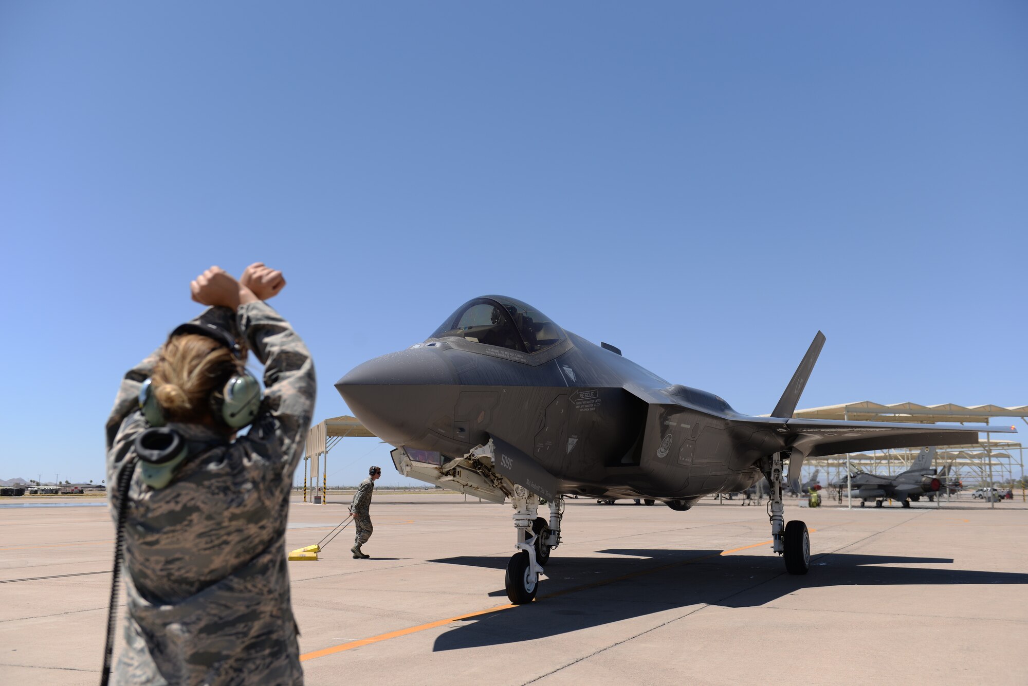 Lightning Integrated Technician team members taxi-in an F-35A Lightning II June 8, 2018, at Luke Air Force Base, Ariz. With the LIT team, multiple components of an aircraft undergoing maintenance can be worked on simultaneously. (U.S. Air Force photo by Senior Airman Ridge Shan)
