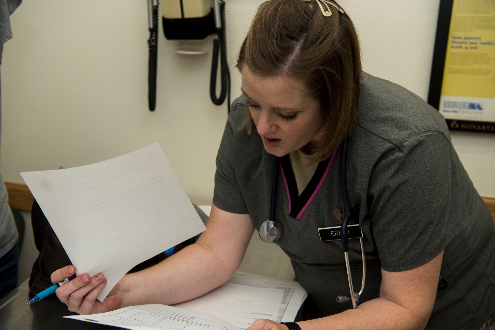 U.S. Army Maj. Natalie Erker, a veterinarian assigned to Fort Lewis Public Health Activity, revises a document at the Veterinary Treatment Facility at Joint Base Elmendorf-Richardson, Alaska, July 6, 2018. The facility, in Building 47815 between 5th and 6th Street on Davis Highway, offers a variety of services like canine and feline services, health certificates, sick call, allergy testing and more.