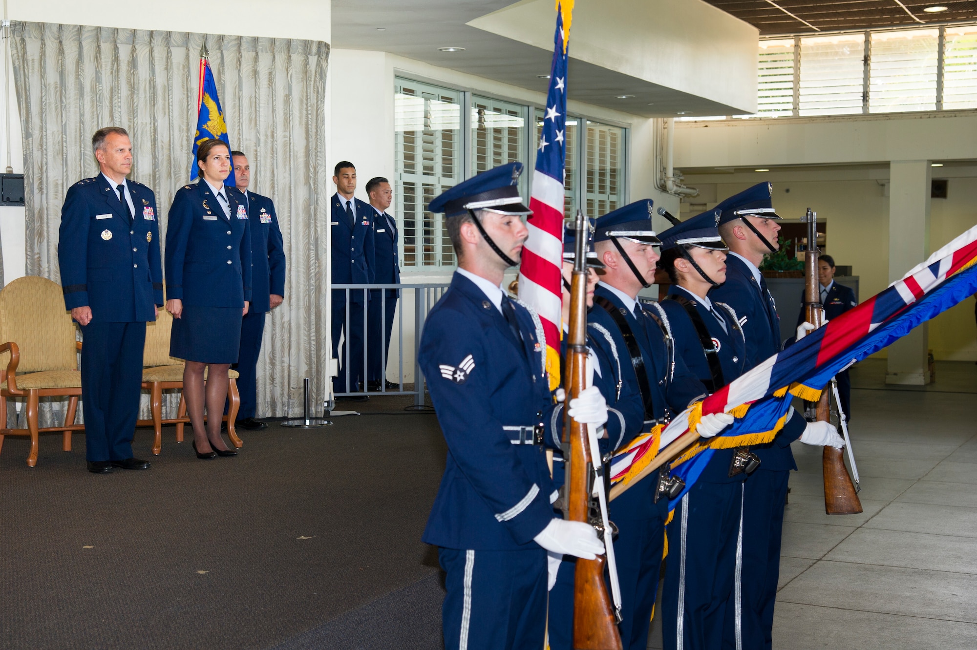 U.S. Air Force Airmen from the Hickam Field Honor Guard present the colors during the 624th Regional Support Group assumption of command ceremony at Joint Base Pearl Harbor-Hickam, Hawaii, July 7, 2018.