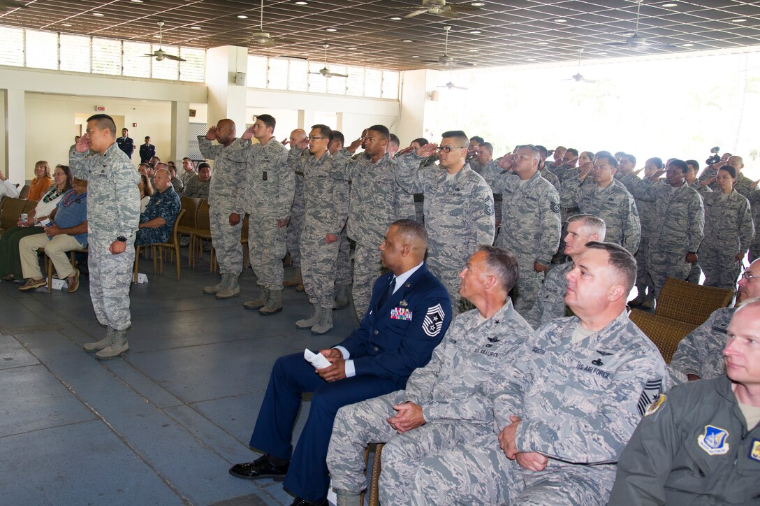 U.S. Air Force Reserve Airmen from the 624th Regional Support Group salute Col. Athanasia Shinas, commander, during an assumption of command ceremony at Joint Base Pearl Harbor-Hickam, Hawaii, July 7, 2018.