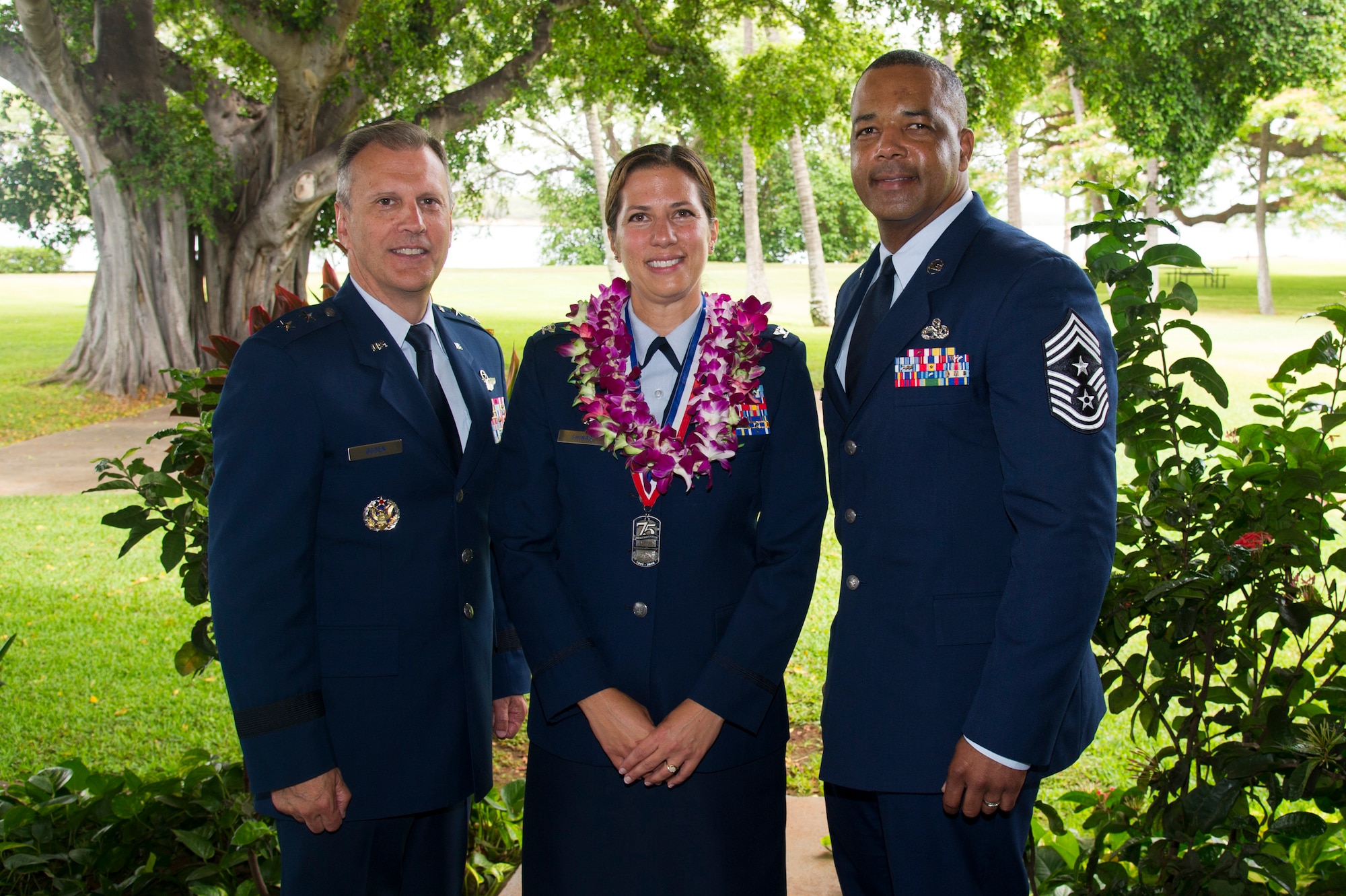 U.S. Air Force Maj. Gen. Randall Ogden, 4th Air Force commander, Col. Athanasia Shinas, 624th Regional Support Group commander, and Chief Master Sgt. Timothy White, 4th Air Force command chief, following an assumption of command ceremony at Joint Base Pearl Harbor-Hickam, Hawaii, July 7, 2018.
