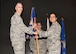 Col. Casey Campbell, 51st Medical Group commander, gives the 51st Medical Group guidon to Lt. Col. Jennifer Lavergne during a change of command ceremony at the Enlisted Club, June 29, 2018. During the ceremony, Lt. Col. Jennifer Lavergne took command of the 51st Medical Support squadron from Lt. Col. Charles Marek, 51st MDSS outgoing commander. (U.S. Air Force photo by Airman 1st Class Ilyana A. Escalona)