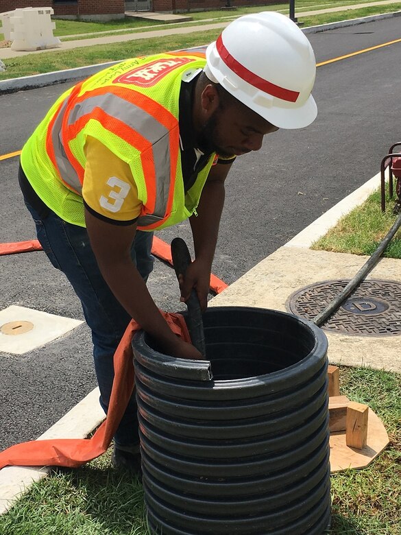 Sean Dawley Jr., a senior architecture major from Hampton University, conducts a water retention inspection at Camp Humphreys, South Korea, July 5