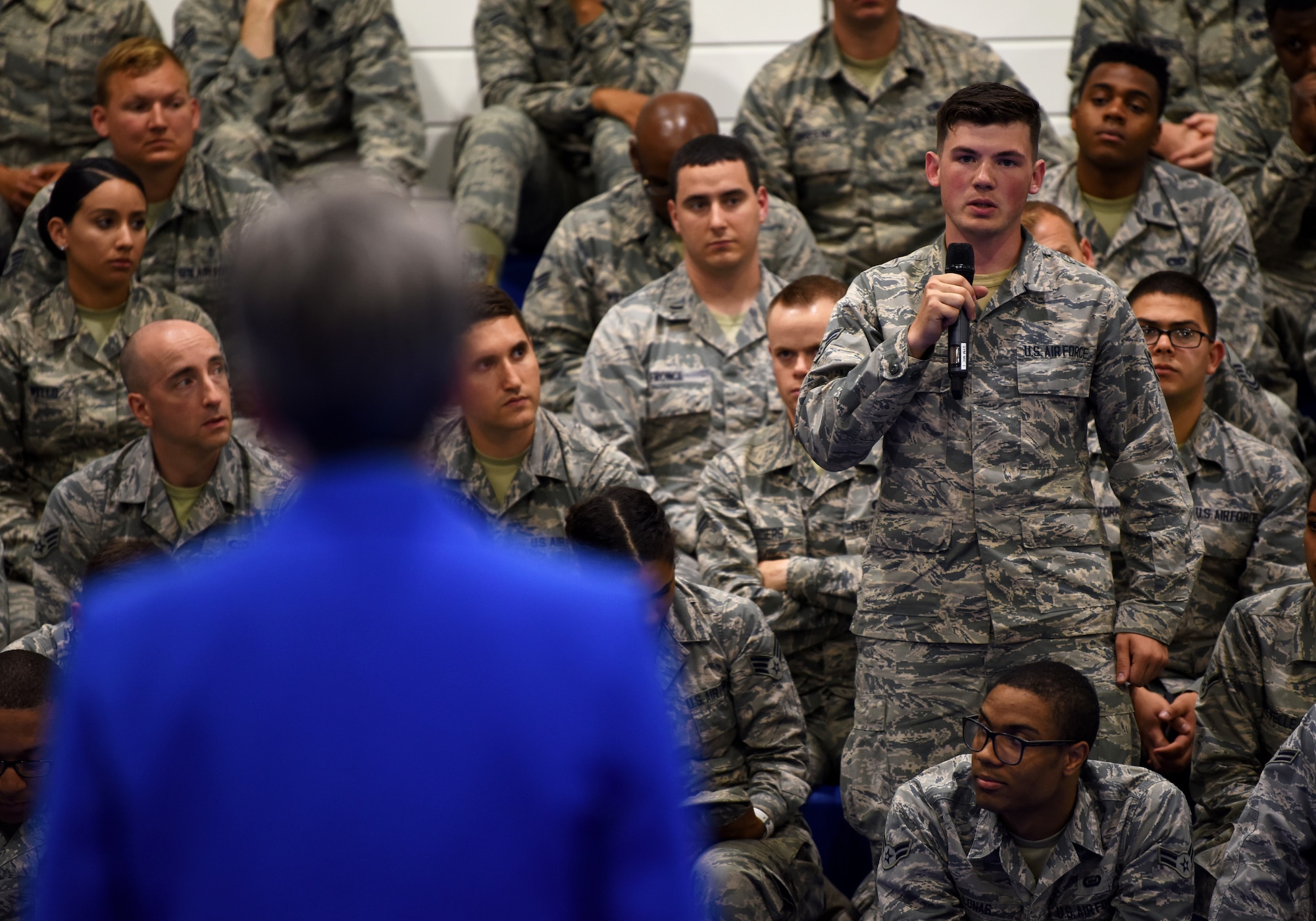 Secretary of the Air Force Heather Wilson takes a question from a Liberty Wing Airman at Royal Air Force Lakenheath, England, July 11, 2018. During the town hall, Wilson explained how the Air Force is focusing on the fight of the future and the importance of the branch’s current five major priorities: restoring readiness, completing cost-effective modernization, driving innovation, developing exceptional leaders, and strengthening U.S. Alliances and partnerships. (U.S. Air Force photo by Staff Sgt. Alex Fox Echols III)