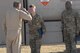 Airman 1st Class Jacob Clonts, 332nd Expeditionary Logistics Readiness Petrolium Oil Lubricant distributor, salutes Col. Bryce Silver, 332nd Expeditionary Operations Group commander, after receiving a coin for outstanding performance at an undisclosed location in Southwest Asia, July 6, 2018.