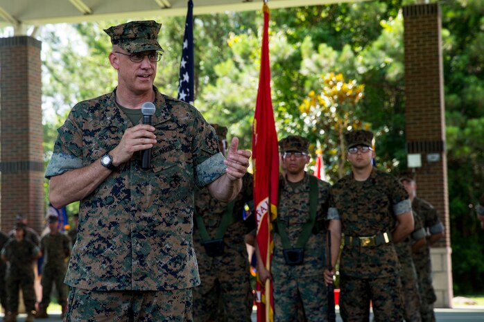 Lt. Col. Lawrence C. Coleman, off-going commanding officer, transfers command to Lt. Col. Scott O. Meredith, on-coming commanding officer, Wounded Warrior Battalion-East, at the WWBN-East Outdoor Basketball Pavilion on Marine Corps Base Camp Lejeune, N.C., June 21, 2018. The change of command formally transferred authorities and responsibilities of WWBN-E from Lt. Col. Lawrence C. Coleman to Lt. Col. Scott O. Meredith. (U.S. Marine Corps photo by Lance Cpl. Nathan Reyes)