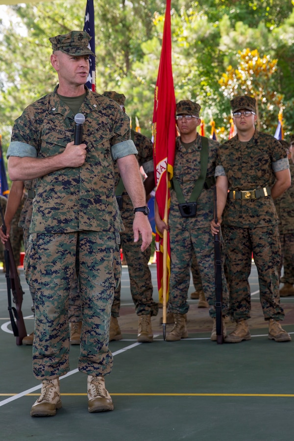 Lt. Col. Lawrence C. Coleman, off-going commanding officer, transfers command to Lt. Col. Scott O. Meredith, on-coming commanding officer, Wounded Warrior Battalion-East, at the WWBN-East Outdoor Basketball Pavilion on Marine Corps Base Camp Lejeune, N.C., June 21, 2018. The change of command formally transferred authorities and responsibilities of WWBN-E from Lt. Col. Lawrence C. Coleman to Lt. Col. Scott O. Meredith. (U.S. Marine Corps photo by Lance Cpl. Nathan Reyes)