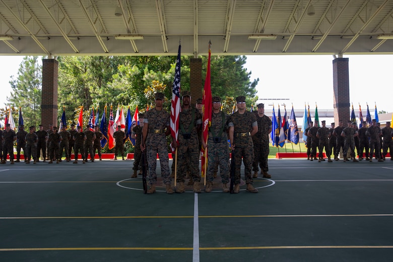 Lt. Col. Lawrence C. Coleman, off-going commanding officer, transfers command to Lt. Col. Scott O. Meredith, on-coming commanding officer, Wounded Warrior Battalion-East, at the WWBN-East Outdoor Basketball Pavilion on Marine Corps Base Camp Lejeune, N.C., June 21, 2018. The change of command formally transferred authorities and responsibilities of WWBN-E from Lt. Col. Lawrence C. Coleman to Lt. Col. Scott O. Meredith. (U.S. Marine Corps photo by Lance Cpl. Nathan Reyes)