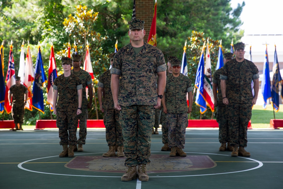 Lt. Col. Lawrence C. Coleman, off-going commanding officer, transfers command to Lt. Col. Scott O. Meredith, on-coming commanding officer, Wounded Warrior Battalion-East, at the WWBN-East Outdoor Basketball Pavilion on Marine Corps Base Camp Lejeune, N.C., June 21, 2018. The change of command formally transferred authorities and responsibilities of WWBN-E from Lt. Col. Lawrence C. Coleman to Lt. Col. Scott O. Meredith. (U.S. Marine Corps photo by Lance Cpl. Nathan Reyes)