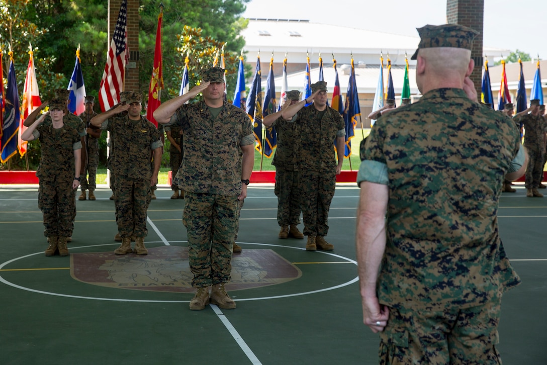 Lt. Col. Lawrence C. Coleman, off-going commanding officer, transfers command to Lt. Col. Scott O. Meredith, on-coming commanding officer, Wounded Warrior Battalion-East, at the WWBN-East Outdoor Basketball Pavilion on Marine Corps Base Camp Lejeune, N.C., June 21, 2018. The change of command formally transferred authorities and responsibilities of WWBN-E from Lt. Col. Lawrence C. Coleman to Lt. Col. Scott O. Meredith. (U.S. Marine Corps photo by Lance Cpl. Nathan Reyes)