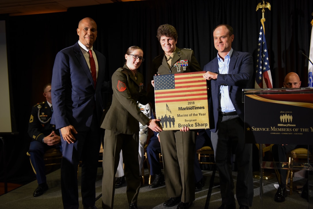U.S. Marine Corps Sgt. Brooke Sharp poses for a photo with Lt. Gen. Lori Reynolds while reviving her award for being named the 2018 Marine Times Marine of the Year July 11, 2018. Sgt. Sharp received this award in recognition of her efforts while deployed to Helmand Province, Afghanistan.