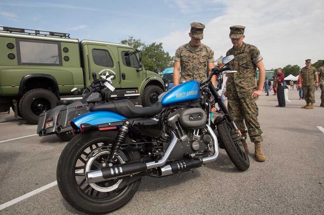 Marines admire a motorcycle during the exposition portion of a Semper Ride event on Marine Corps Base Camp Lejeune, June 26. Educating service members on the correct way to ride a motorcycle is the main mission of Semper Ride gatherings. (U.S. Marine Corps photo by Lance Cpl. Nathan Reyes)
