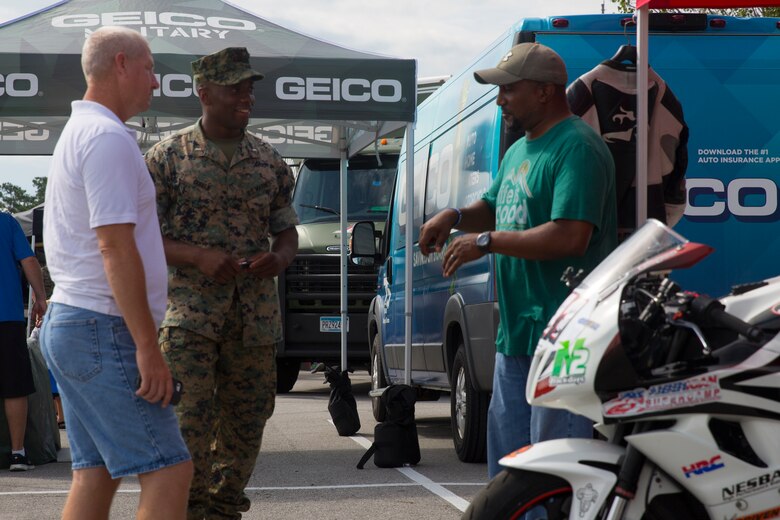 Marines discuss motorcycle safety during the exposition portion of a Semper Ride event on Marine Corps Base Camp Lejeune, June 26. Educating service members on the correct way to ride a motorcycle is the main mission of Semper Ride gatherings. (U.S. Marine Corps photo by Lance Cpl. Nathan Reyes)