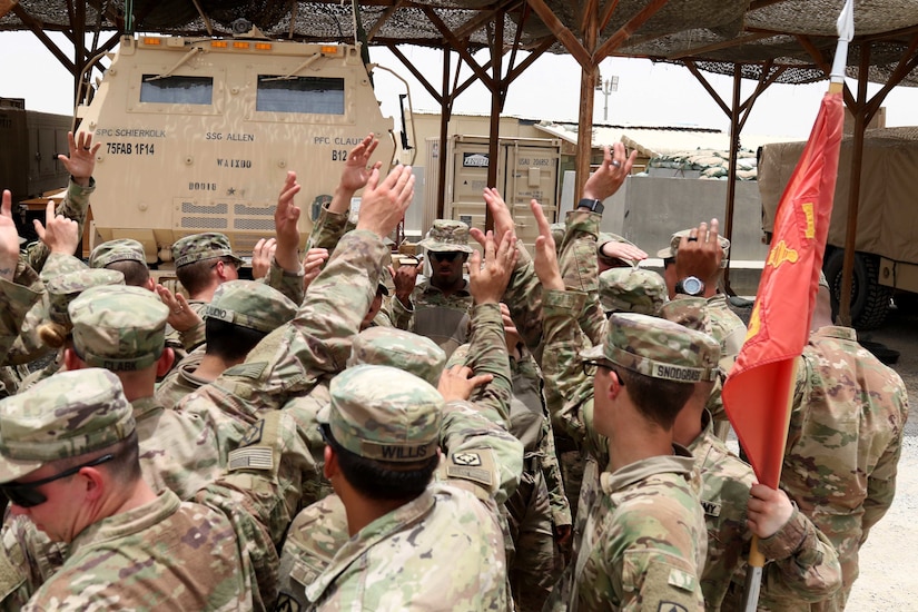 Soldiers from Bravo Battery, 1st Battalion, 14th Field Artillery Regiment, 65th Field Artillery Brigade, Task Force Spartan, celebrate the conclusion of exercise Golden Sparrow on June 29, 2018. The Soldiers coordinated and fired/ reloaded “dry” missions for over 26-hours.