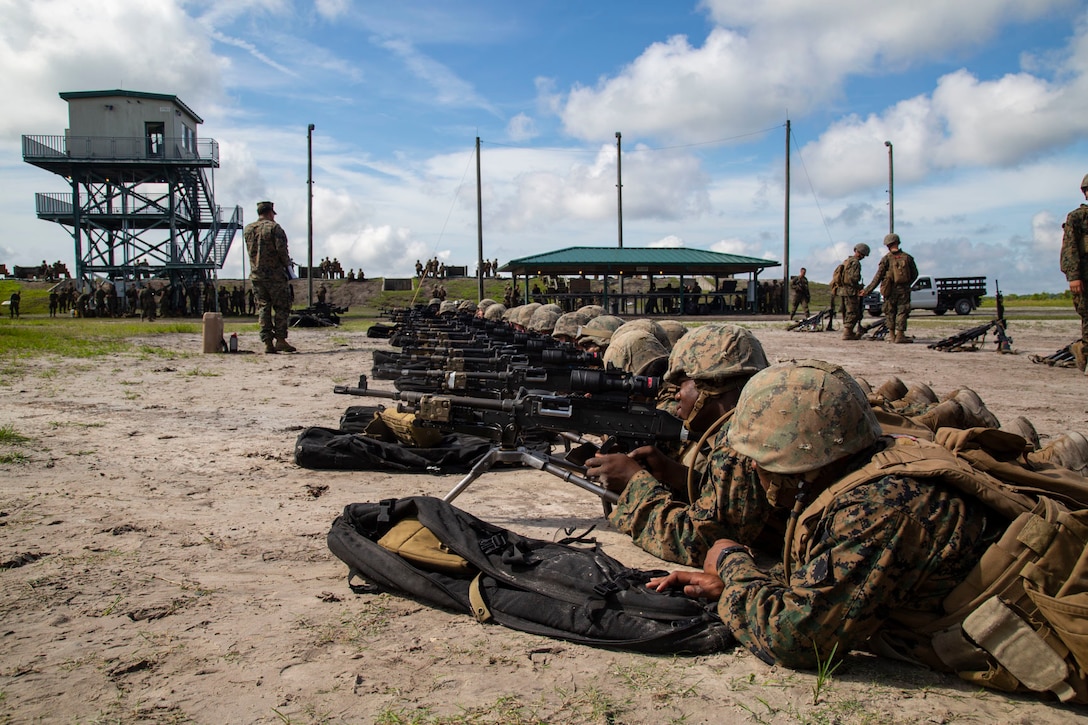 U.S. Marines with Fox Company, Marine Combat Training Battalion (MCT), School of Infantry-East, sight in on an a M240G Medium Machinegun during Table 3 and 4 marksmanship training, Camp Lejeune, N.C., June 27, 2018. MCT conducts standards-based common combat skills training of entry-level Marines in order to create riflemen for service throughout the Marine Corps. (U.S. Marine Corps photo by Lance Cpl. Ashley Gomez)