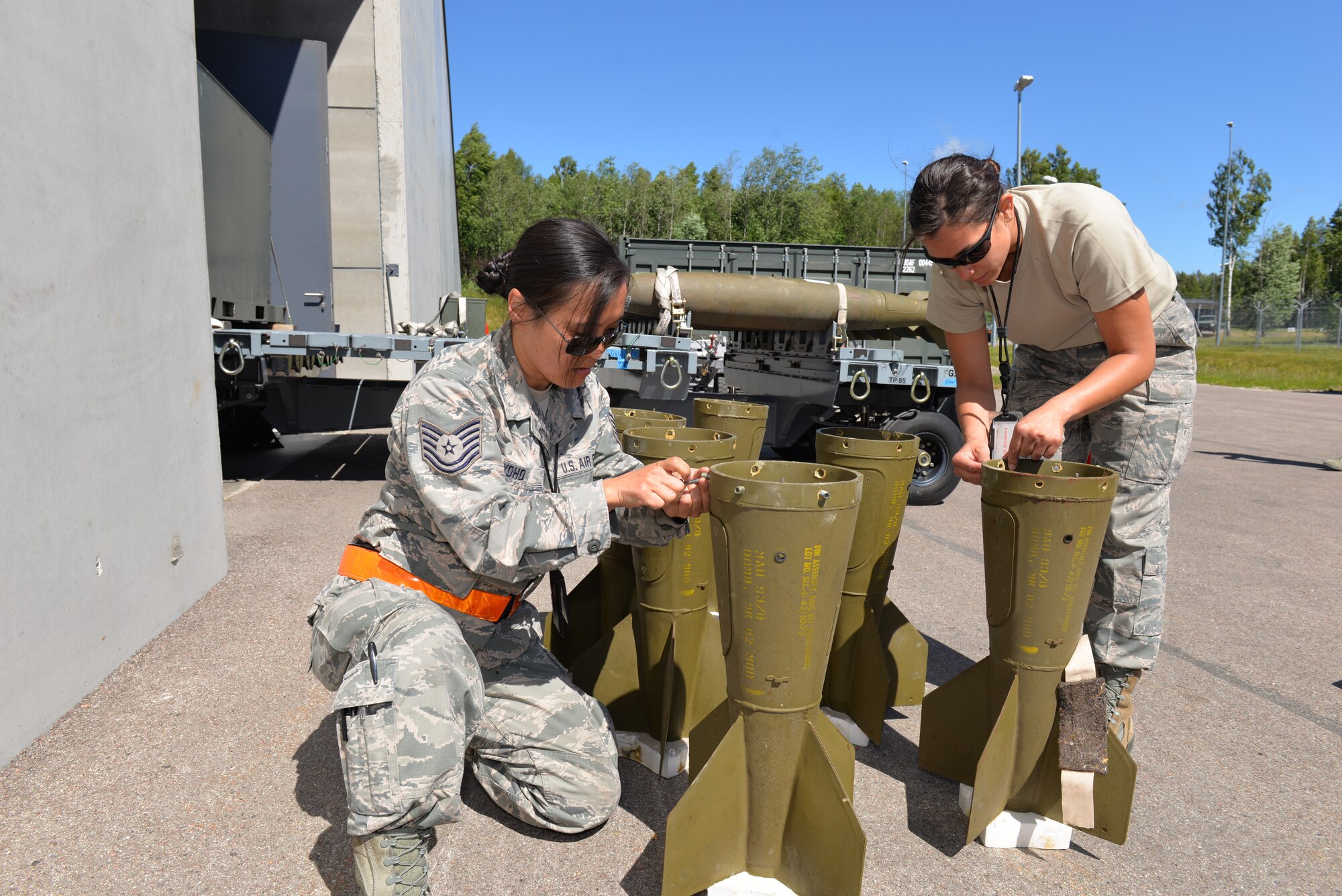 U.S Air Force Tech. Sgt. Cinde Yoho, munitions controller and Staff. Sgt. Allna Decker, munitions accountability, both assigned to the 140th Wing Maintenance Group, Colorado Air National Guard, fix MK-82 500 pound bomb components, in support of the live ammunition drop during the Saber Strike 18, Amari Air Base, Estonia, June 4, 2018.