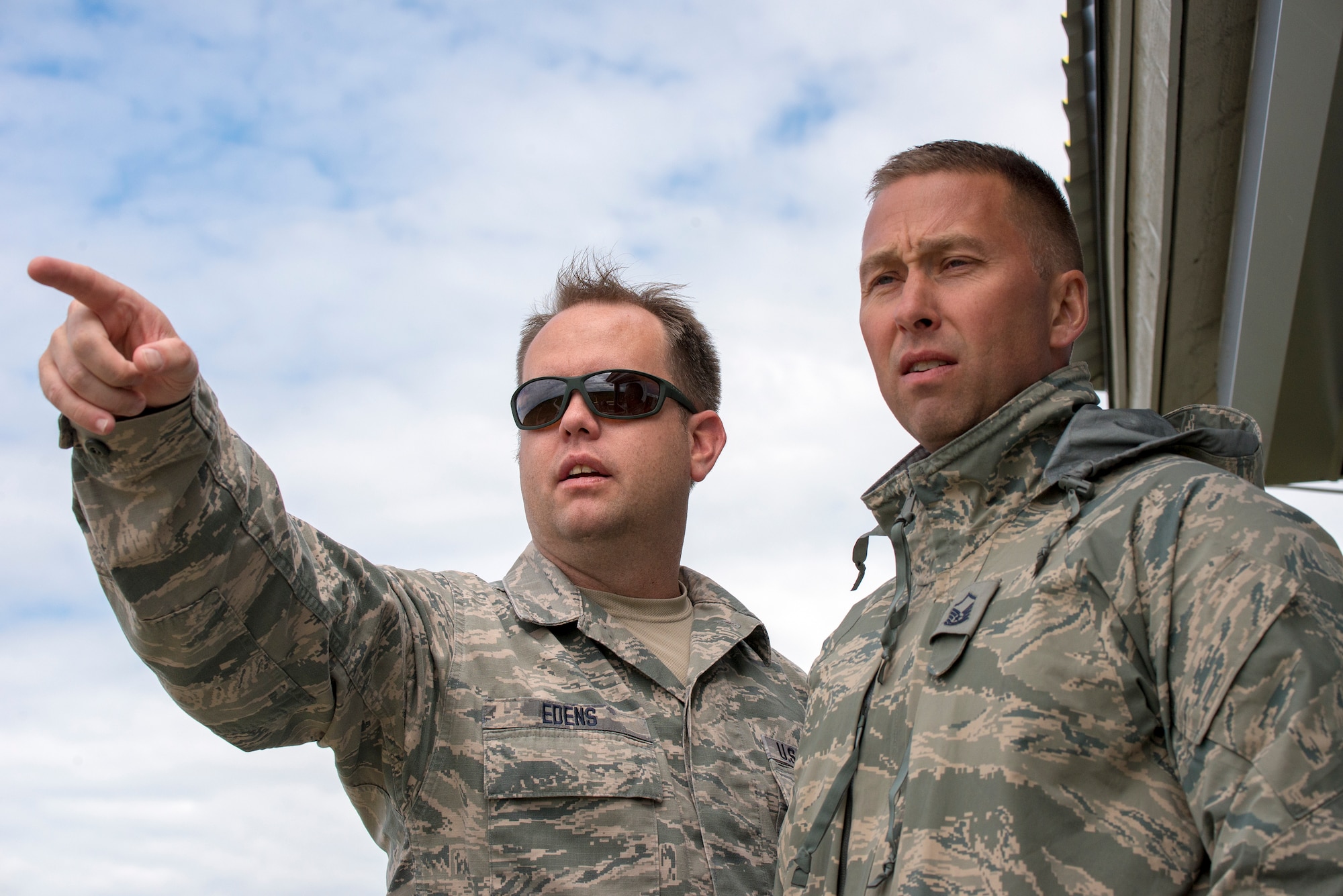 Master Sgt’s Preston Edens, a range controller and Luke Vanderwerf, a first sergeant, both from the 140th Wing, Colorado Air National Guard out of Buckley Air Force Base, discuss targets for aircraft at Papa Range, Estonia, in support of exercise Trojan Footprint, June 6, 2018.