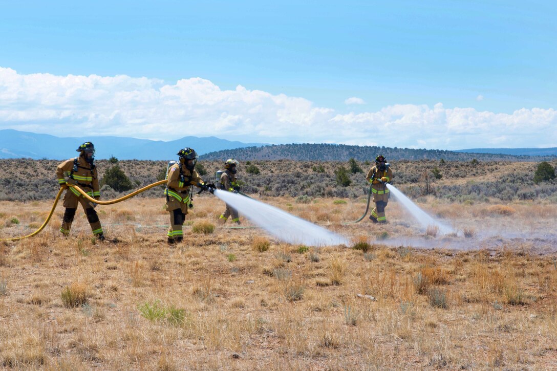 Soldiers conduct firefighting training to prepare for the real-world wildfires.