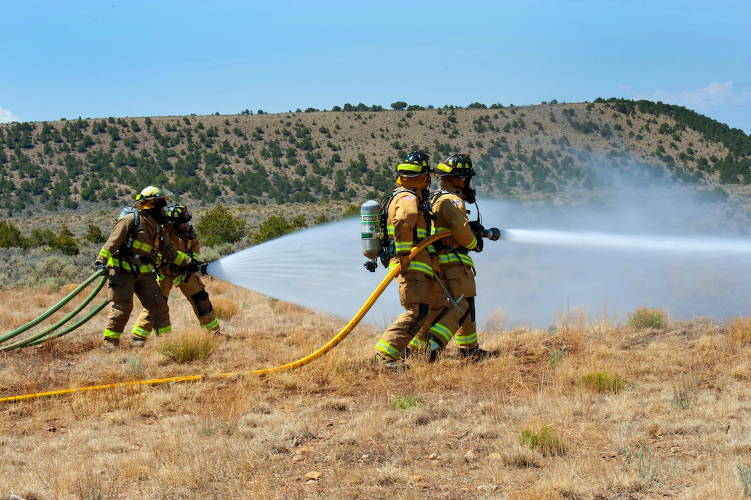 Soldiers conduct fire hose technique training to prepare for the real-world wild fires.