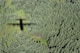 The shadow of a C-130J Super Hercules flies over the dense woods of Germany, July 2, 2018. This particular C-130J led the formation during an exercise that involved four other C-130Js. Once the pilots have led a formation long enough, they are recognized as multi-element flight lead qualified pilots. Multi-element flight lead qualified pilots help ensure the 37th Airlift Squadron is prepared to accomplish one of its primary missions: aerial delivery and mass on the drop-zone.