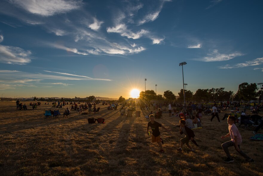 Hundreds of people await the Intel Shooting Star Drone show at Travis Air Force Base, Calif., July 5 during the base’s Independence Day celebration. The event featured numerous activities including music, bounce houses and an eight minute light show with 500 drones. (U.S. Air Force photo by Master Sgt. Joey Swafford)