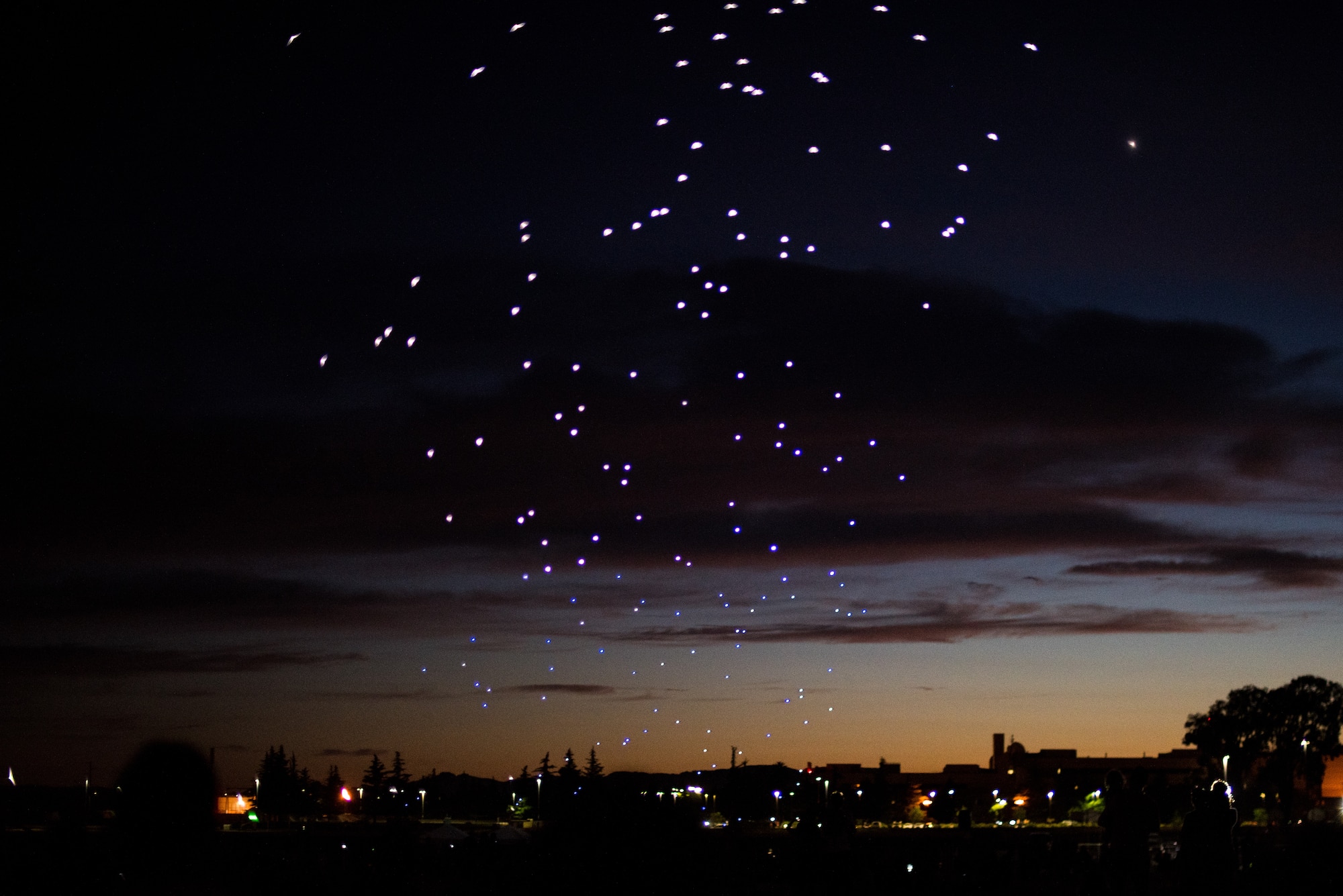 Intel Shooting Star Drones fly into the sky over Travis Air Force Base, Calif., July 5 during the base’s Independence Day celebration. The event featured numerous activities including music, bounce houses and an eight minute light show with 500 drones. (U.S. Air Force photo by Master Sgt. Joey Swafford)