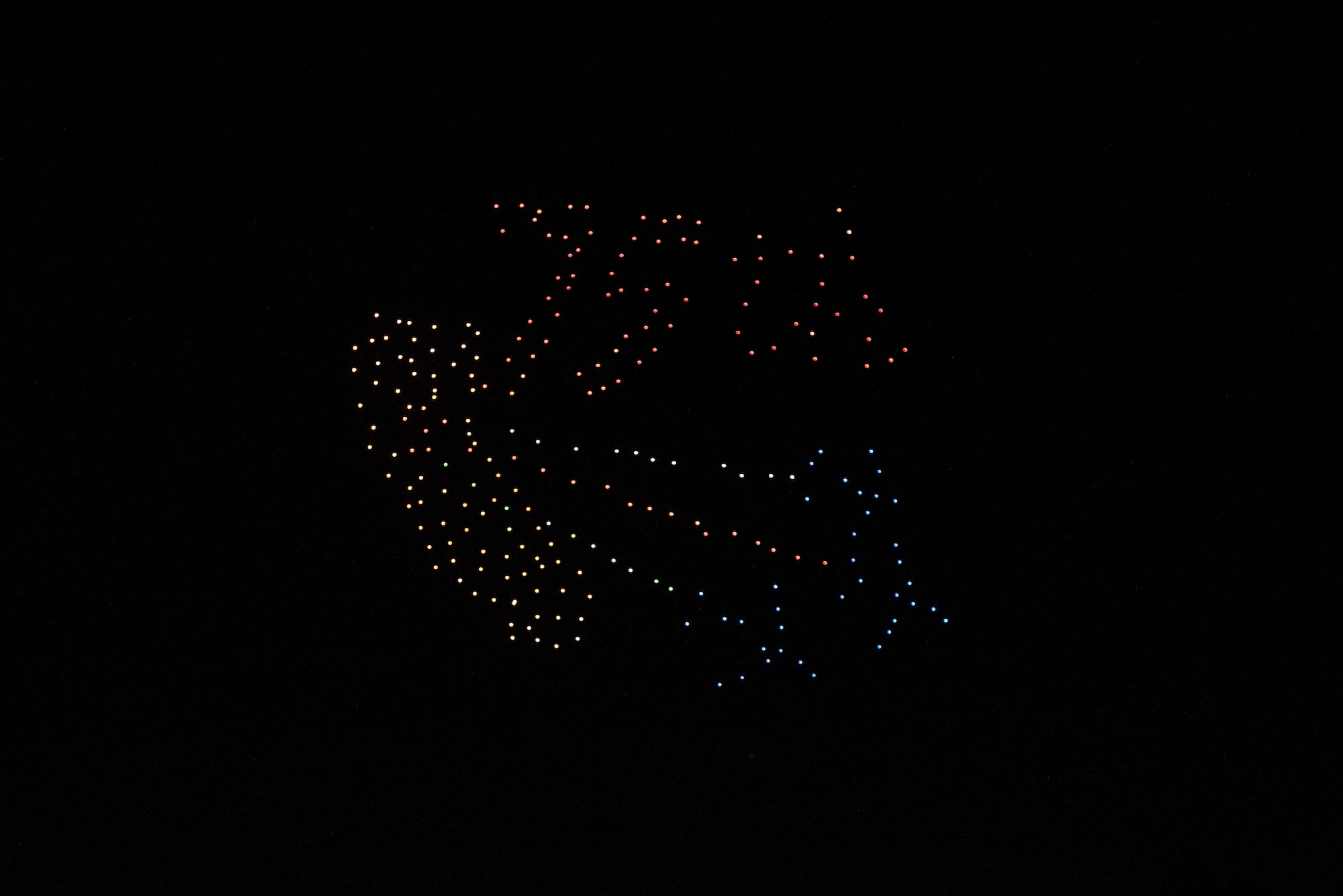 Intel Shooting Star Drones form the 75th Anniversary symbol for Travis Air Force Base, Calif., in the sky over Travis July 5 during the base’s Independence Day celebration. The event featured numerous activities including music, bounce houses and an eight minute light show with 500 drones. (U.S. Air Force photo by Master Sgt. Joey Swafford)