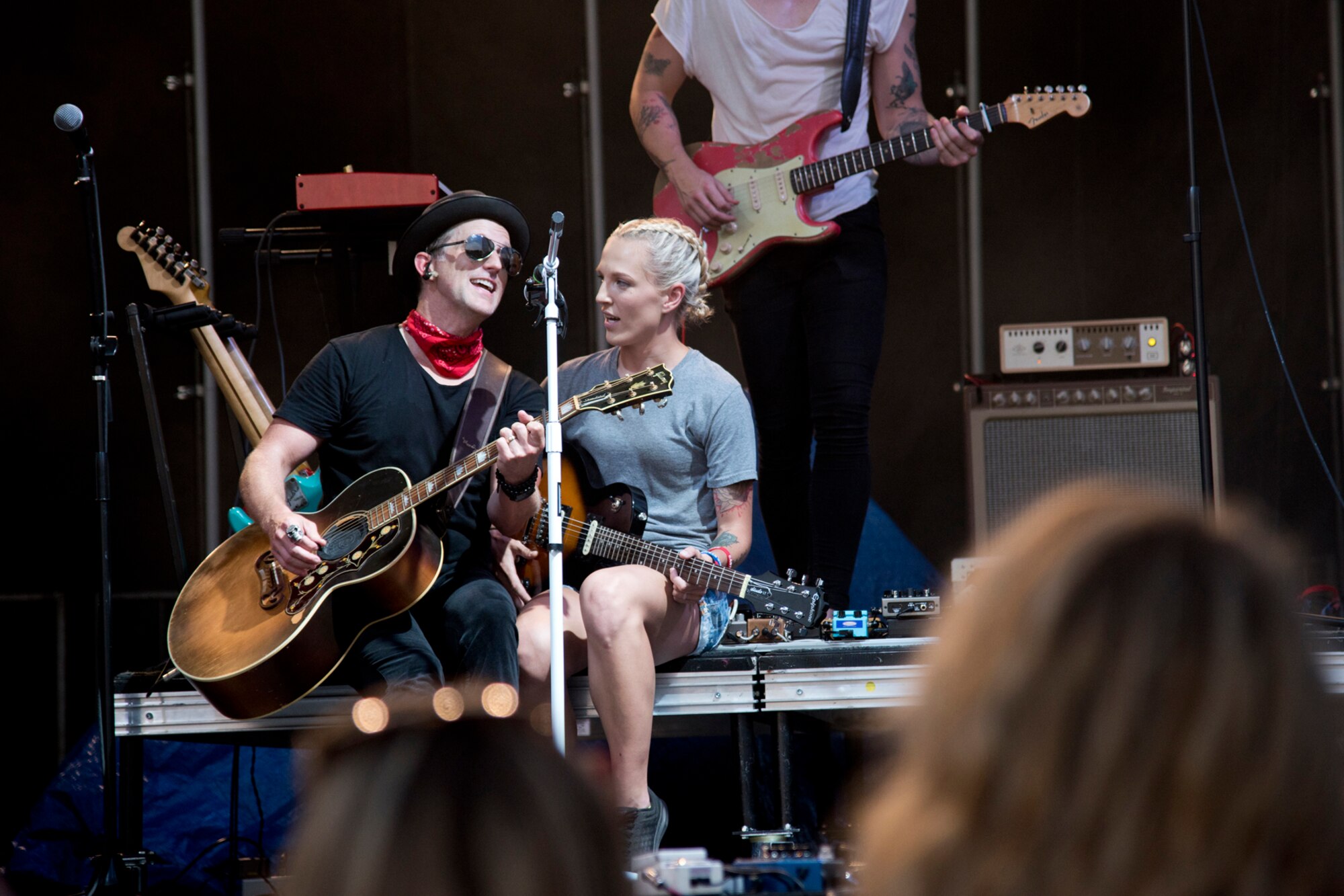 U.S. Air Force Airman 1st Class Nastia Kanakares, aircrew flight equipment, 19th Operations Support Squadron, sings along with Keifer Thompson of Thompson Square during Liberty Fest at Little Rock Air Force Base, Ark., July 7, 2018.