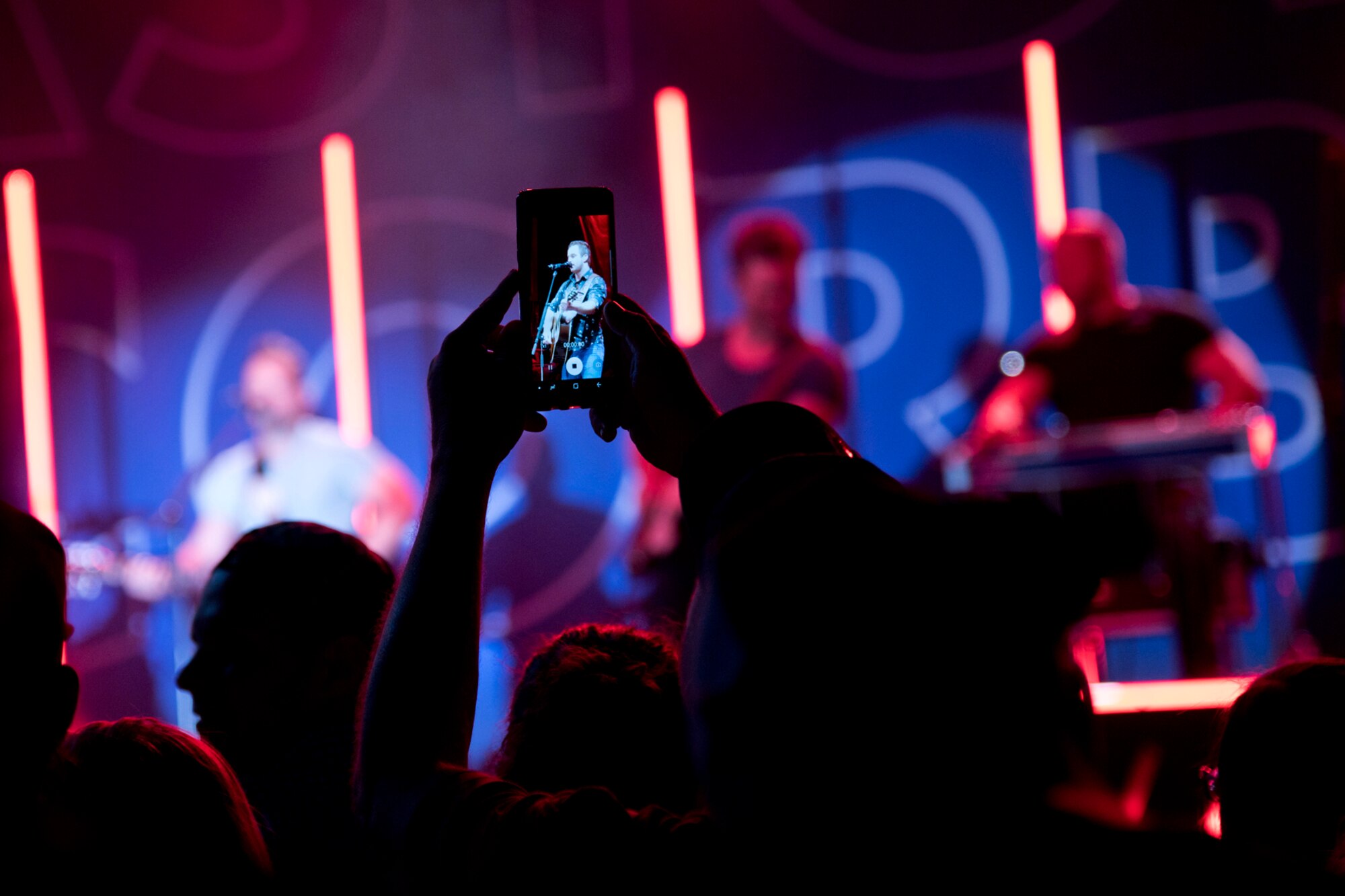 Easton Corbin, a country music singer, is recorded on a concert goer’s cell phone during the Liberty Fest celebration at Little Rock Air Force Base, Ark., July 7, 2018.