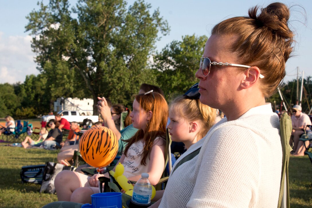 (Right to Left) U.S. Air Force Reserve Master Sgt. Debra Gentry, noncommissioned officer in charge, command support staff, 96th Aerial Port Squadron, and her daughters Anna and Madyson enjoy a live performance from Thompson Square during the Liberty Fest celebration in Heritage Park on Little Rock Air Force Base, Ark., July 7, 2018.