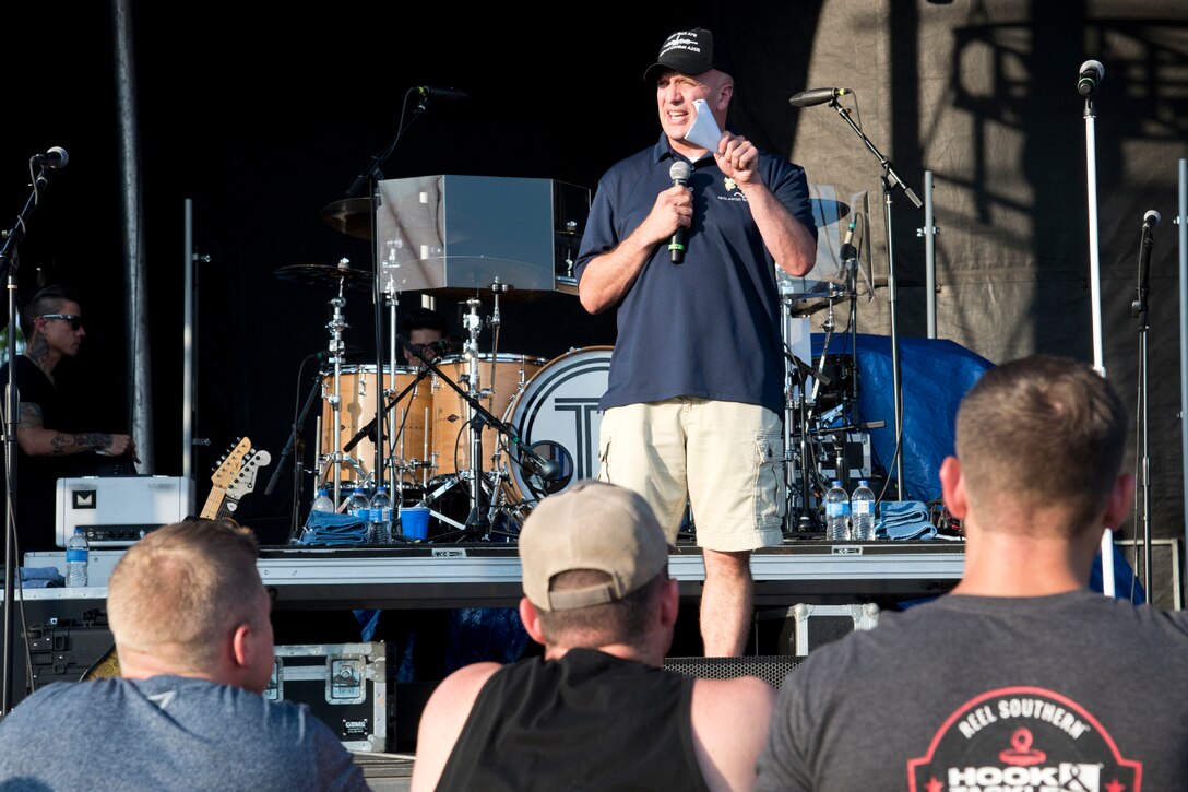 U.S. Air Force Col. Gerald Donohue, commander, 19th Airlift Wing, welcomes concert goers to the Liberty Fest celebration, July 7, 2017, at Little Rock Air Force Base, Ark.