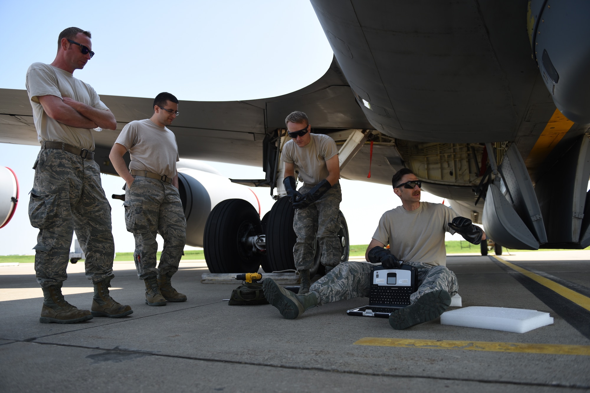 Pennsylvania Air National Guardsmen Staff Sgt. Patrick Olish, Senior Airman Nick Black, and Tech. Sgt. Cameron Bish listen to the instructions of Master Sgt. Bryan Schulz as they prepare to perform operational maintenance on the Large Aircraft Infrared Counter-Measure third generation prototype system at the 171st Air Refueling Wing May 24, 2018. (U.S. Air National Guard Photo by Senior Airman Bryan Hoover)