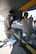 Pennsylvania Air National Guardsmen Master Sgt. Bryan Schulz and Tech. Sgt. Cameron Bish with the 171st Air Refueling Wing demonstrate capabilities to perform maintenance on the Large Aircraft Infrared Counter-Measure third generation prototype system while wearing MOPP gloves May 24, 2018. The demonstration is the first to be performed by any member of the Air National Guard. (U.S. Air National Guard Photo by Senior Airman Bryan Hoover)