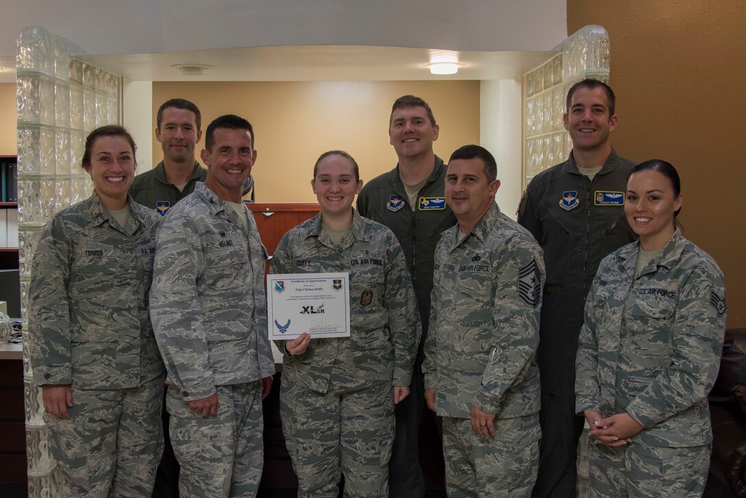 Staff Sgt. Chelsea Duffy, 47th Flying Training Wing self-assessment program manager, was chosen by wing leadership to be the “XLer” of the week, for the week of June 25, 2018, at Laughlin Air Force Base, Texas. The “XLer” award, presented by Col. Charlie Velino, 47th Flying Training Wing commander, is given to those who consistently make outstanding contributions to their unit and the Laughlin mission. (U.S. Air Force photo by Airman 1st Class Daniel Hambor)