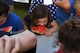 Children participate in a timed watermelon-eating competition during the Freedom Fest hosted on July 3, 2018, on Grand Forks AFB, North Dakota. More than 300 military members, families and friends gathered for the first annual which featured live music, games, bouncy houses, fireworks and more. (U.S. Air Force photo by Airman 1st Class Elora J. Martinez)