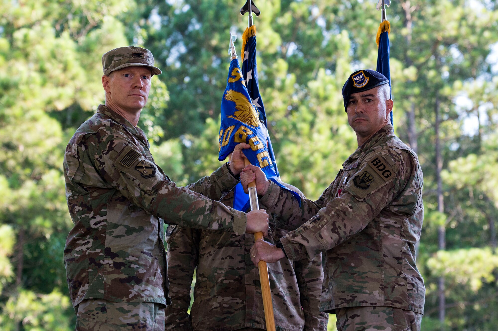 Col. Paul Birch, left, 93d Air Ground Operations Wing commander, and Col. Kevin Walker, 820th Base Defense Group (BDG) outgoing commander, pose for a photo during at change of command ceremony, July 12, 2018, a Moody Air Force Base, Ga. The ceremony represents the formal passing of responsibility, authority and accountability of command from one officer to another. Col. Benito Barron, 820th BDG commander, who recently relinquished his duties as the Chief of the Homeland Defense and Protection Division for Headquarters United States Northern Command, will now command the 820th BDG. The 820th BDG is the Air Force’s only unit specifically designed to provide fully integrated defense operations. (U.S. Air Force photo by Airman 1st Class Erick Requadt)