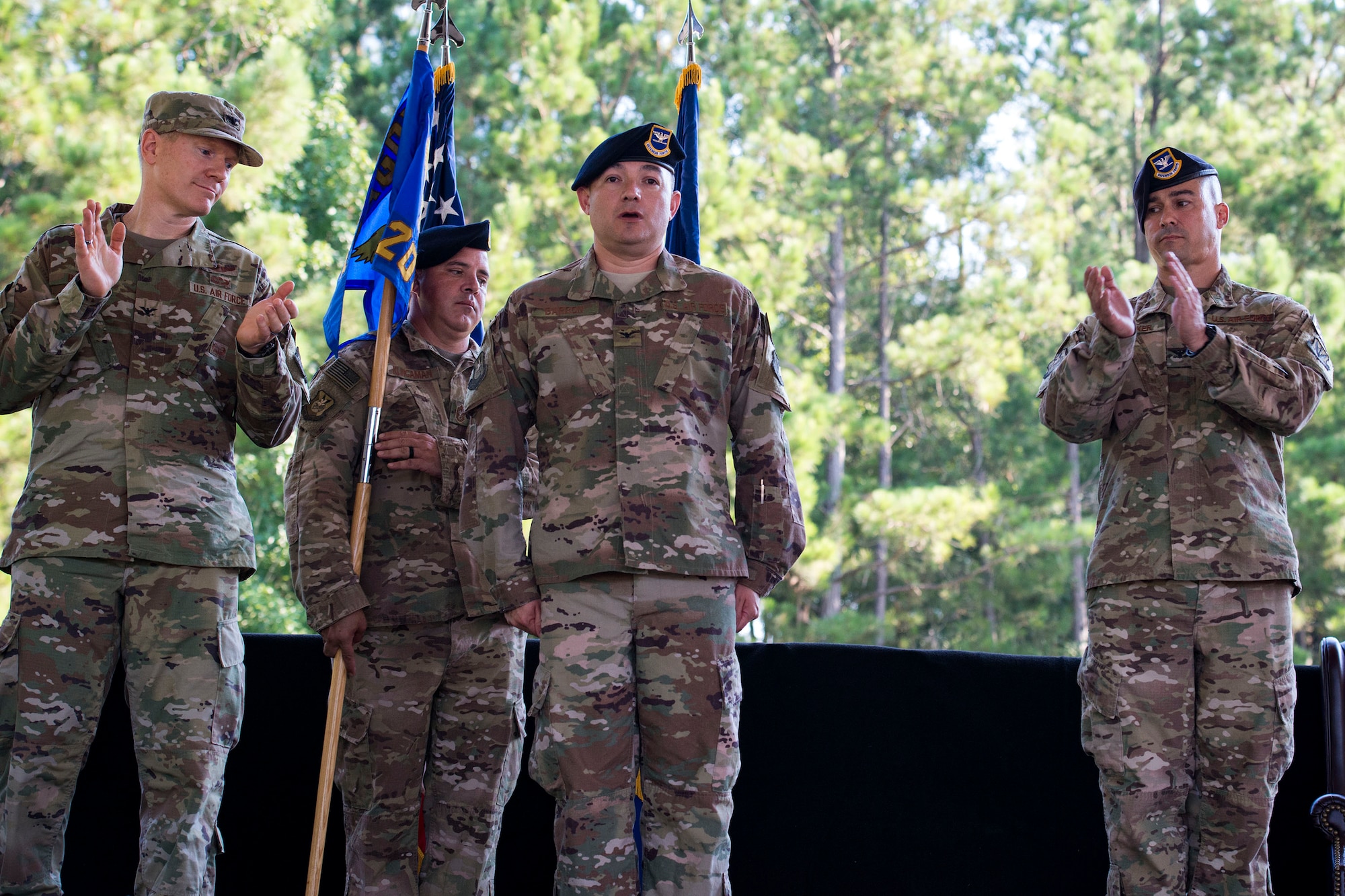 Leadership from the 93d Air Ground Operations Wing congratulates Col. Benito Barron, 820th Base Defense Group (BDG) commander, after he assumes command of the 820th BDG during a change of command ceremony, July 12, 2018, at Moody Air Force Base, Ga. The ceremony represents the formal passing of responsibility, authority and accountability of command from one officer to another. Barron, who recently relinquished his duties as the Chief of the Homeland Defense and Protection Division for Headquarters United States Northern Command, will now command the 820th BDG. The 820th BDG is the Air Force’s only unit specifically designed to provide fully integrated defense operations. (U.S. Air Force photo by Airman 1st Class Erick Requadt)