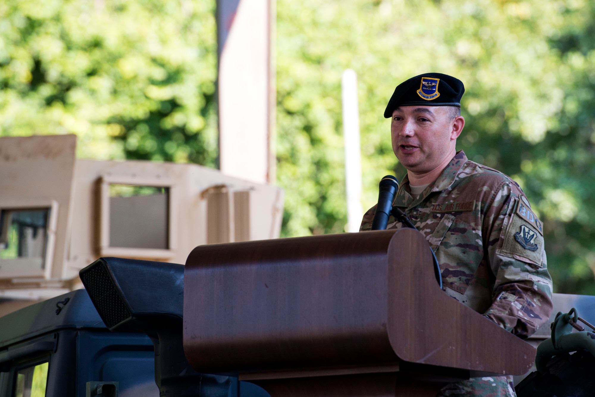 Col. Benito Barron, 820th Base Defense Group (BDG) commander, gives remarks during a change of command ceremony, July 12, 2018, at Moody Air Force Base, Ga. The ceremony represents the formal passing of responsibility, authority and accountability of command from one officer to another. Barron, who recently relinquished his duties as the Chief of the Homeland Defense and Protection Division for Headquarters United States Northern Command, will now command the 820th BDG. The 820th BDG is the Air Force’s only unit specifically designed to provide fully integrated defense operations. (U.S. Air Force photo by Airman 1st Class Erick Requadt)