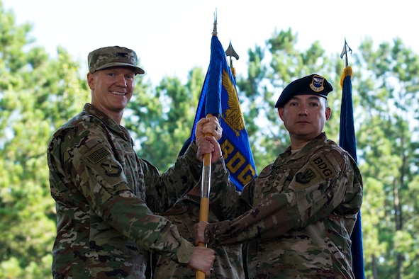 Col. Paul Birch, left, 93d Air Ground Operations Wing commander, and Col. Benito Barron, 820th Base Defense Group (BDG) commander, pose for at photo during a change of command ceremony, July 12, 2018, at Moody Air Force Base, Ga. The ceremony represents the formal passing of responsibility, authority and accountability of command from one officer to another. Barron, who recently relinquished his duties as the Chief of the Homeland Defense and Protection Division for Headquarters United States Northern Command, will now command the 820th BDG. The 820th BDG is the Air Force’s only unit specifically designed to provide fully integrated defense operations. (U.S. Air Force photo by Airman 1st Class Erick Requadt)