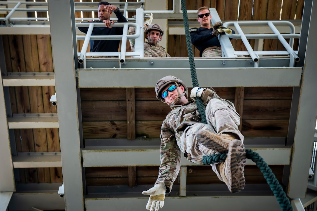 Tech. Sgt. Leland Hastings, 919th Special Operations Security Forces Squadron, demonstrates fast rope braking procedures as he lowers himself from a tower May 5, 2018 on Eglin Air Force Base, Fla.