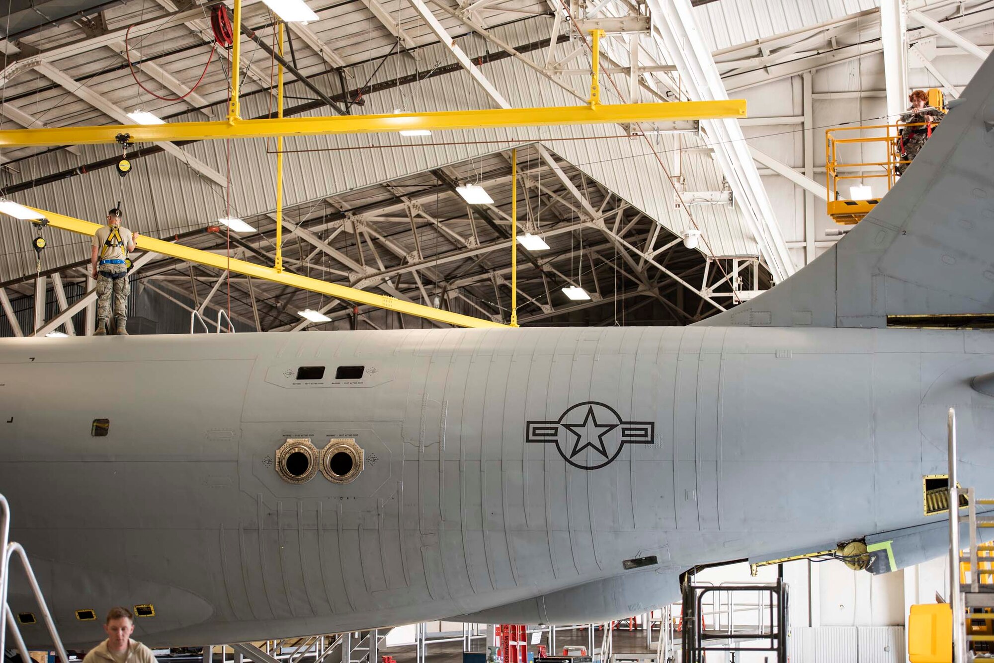 Tech. Sgt. Zina Trimble, right, and Staff Sgt. Shawn Hines, left, both assigned to the 141st Maintenance Squadron, install a new high frequency long wire antenna on a KC-135 Stratotanker during an aircraft inspection June 5, 2018 at Fairchild Air Force Base, Wash. The KC-135 is undergoing an isochronal inspection, which is completed on each aircraft every 24 months to look for discrepancies and to repair those that they may find. (U.S. Air National Guard photo by Tech. Sgt. Kayleigh Phillips)