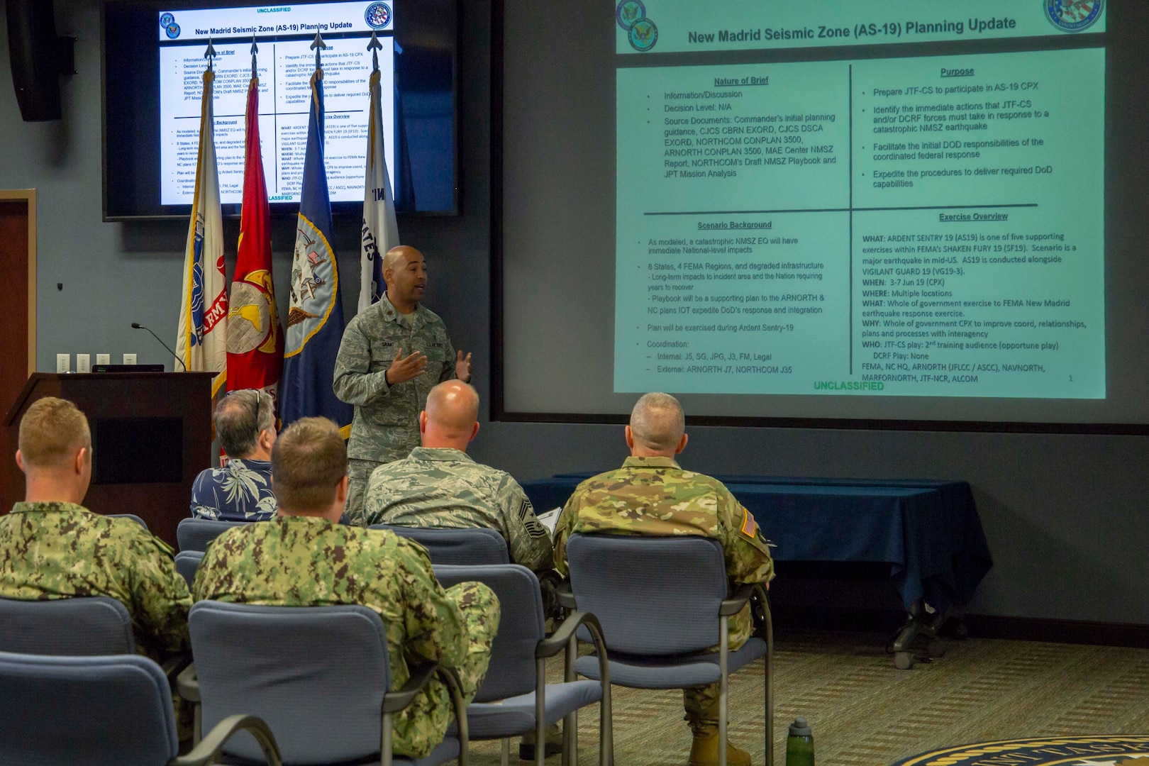 Air Force Maj. Marcus Grant briefs members of Joint Task Force Civil Support (JTF-CS) on exercise Ardent Sentry, which will take place June 3-7, 2019. The exercise will focus on a complex catastrophic earthquake along the New Madrid Seismic Zone (NMSZ) as part of Defense Support of Civil Authorities. When directed, JTF-CS is ready to respond in 24 hours to provide command and control of 5,200 federal military forces located at more than 36 locations throughout the nation acting in support of civil authority response operations to save lives, prevent further injury, and provide critical support to enable community recover. (Official DoD photo by Mass Communication Specialist 3rd Class Michael Redd/released)