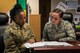 U.S. Air Force Master Sgt. Samantha Ferguson-Oliver, 92 Air Refueling Wing Religious Affairs superintendent, mentors Airman Olivia Simione, 92nd ARW Religious Affairs apprentice at Fairchild Air Force Base, Washington, July 2, 2018. Religious Affairs Airmen and Chaplains continuously develop and grow their skills to offer quality support to Airmen and their families. (U.S. Air Force photo/Airman 1st Class Whitney Laine)