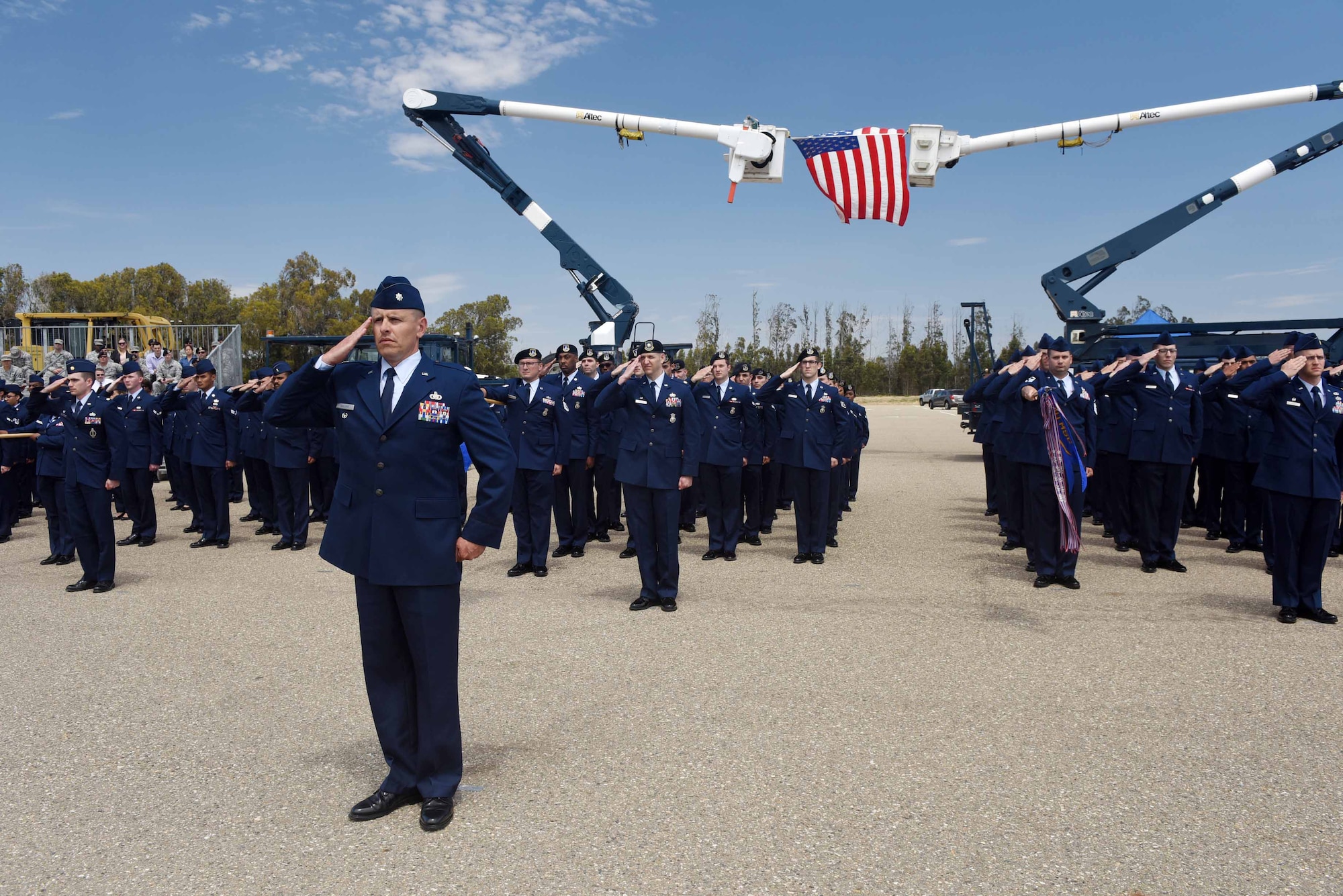 The 30th Mission Support Group renders their final salute to Col. Paul Nosek, 30th Mission Support Group outgoing commander, during a change of command ceremony on July 12, 2018, at Vandenberg Air Force Base, Calif. The 30th MSG provides security, law enforcement, disaster response, civil engineer, base services, mission support, morale services, contracting, and logistical support. (U.S. Air Force photo by Tech. Sgt. Jim Araos/Released)