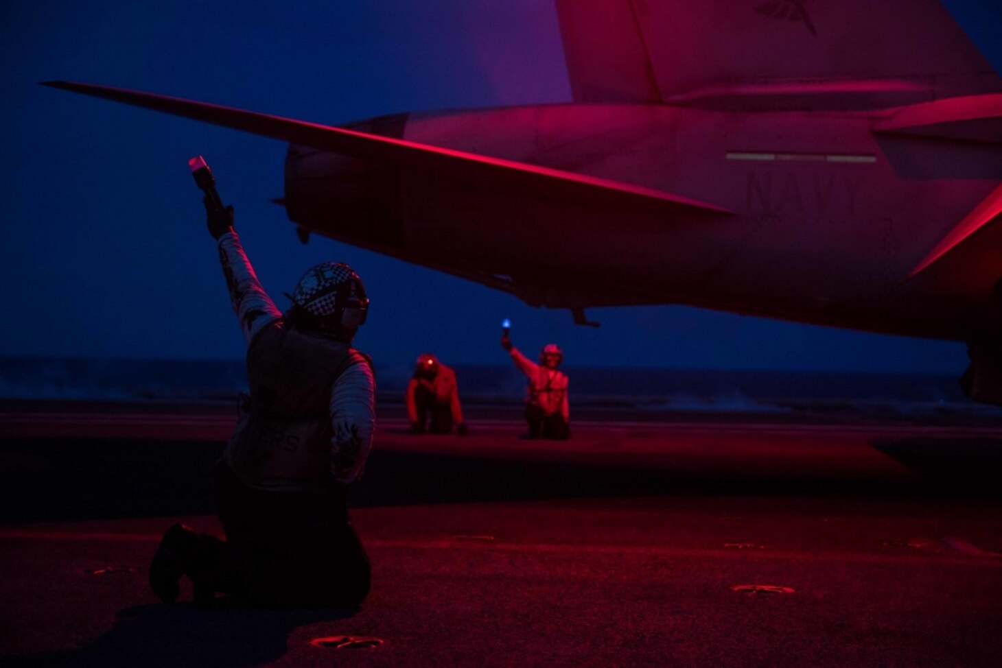 PHILIPPINE SEA (July 06, 2018) Final checkers signal for the launch of an F/A-18E Super Hornet, assigned to Strike Fighter Squadron (VFA) 195, on the flight deck of the Navy's forward-deployed aircraft carrier, USS Ronald Reagan (CVN 76). Ronald Reagan, the flagship of Carrier Strike Group 5, provides a combat-ready force that protects and defends the collective maritime interests of its allies and partners in the Indo-Pacific region.