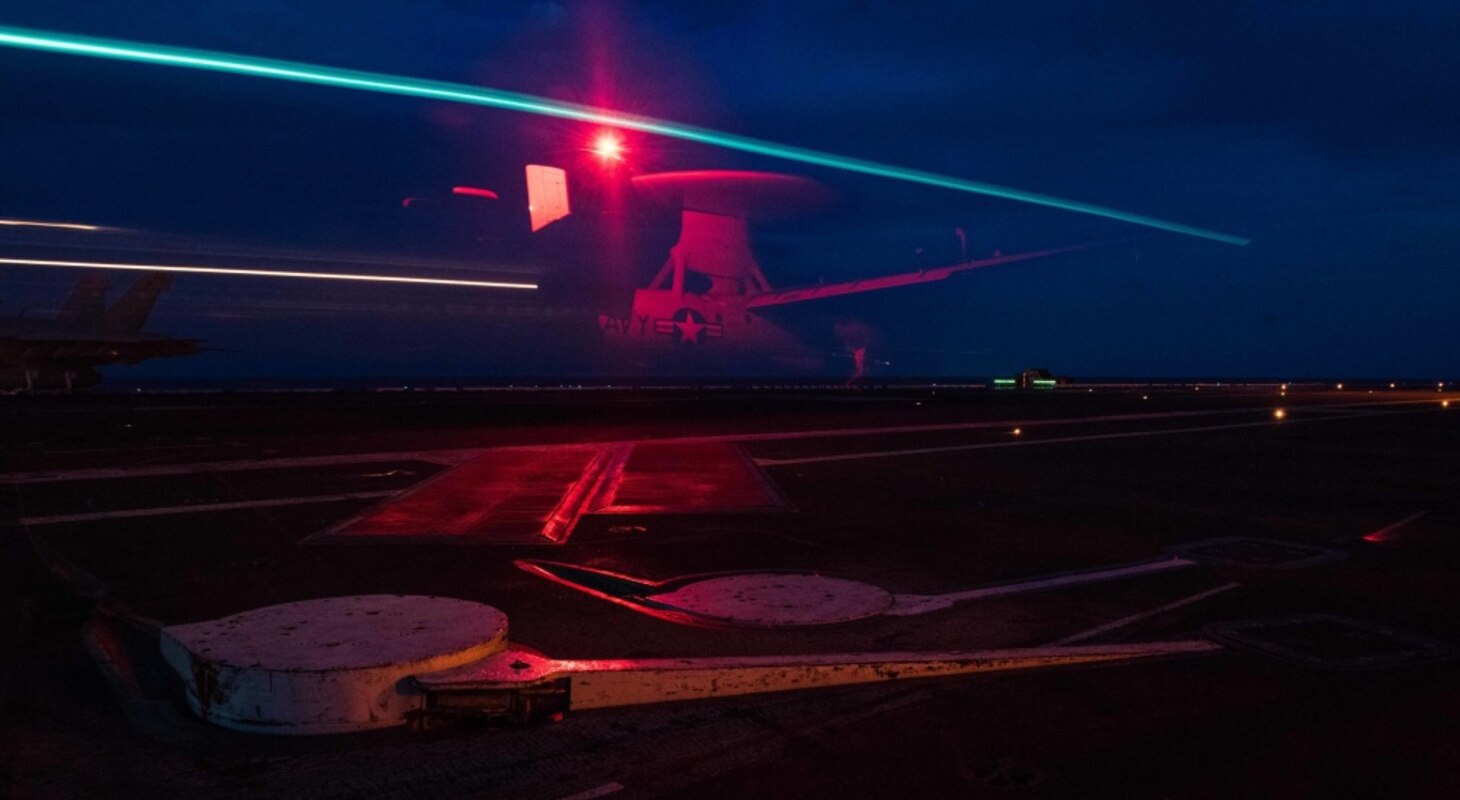 PHILIPPINE SEA (July 06, 2018) An E-2D Hawkeye, assigned to Airborne Early Warning Squadron (VAW) 125, lands on the flight deck of the Navy's forward-deployed aircraft carrier, USS Ronald Reagan (CVN 76). Ronald Reagan, the flagship of Carrier Strike Group 5, provides a combat-ready force that protects and defends the collective maritime interests of its allies and partners in the Indo-Pacific region.